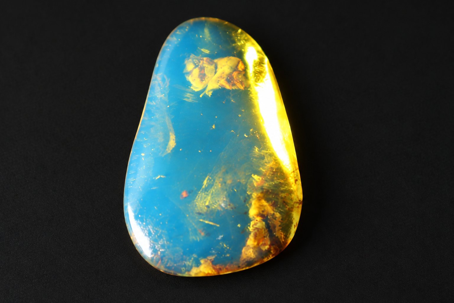 Earth crafted deep blue Dominican amber cabochon – photo 8